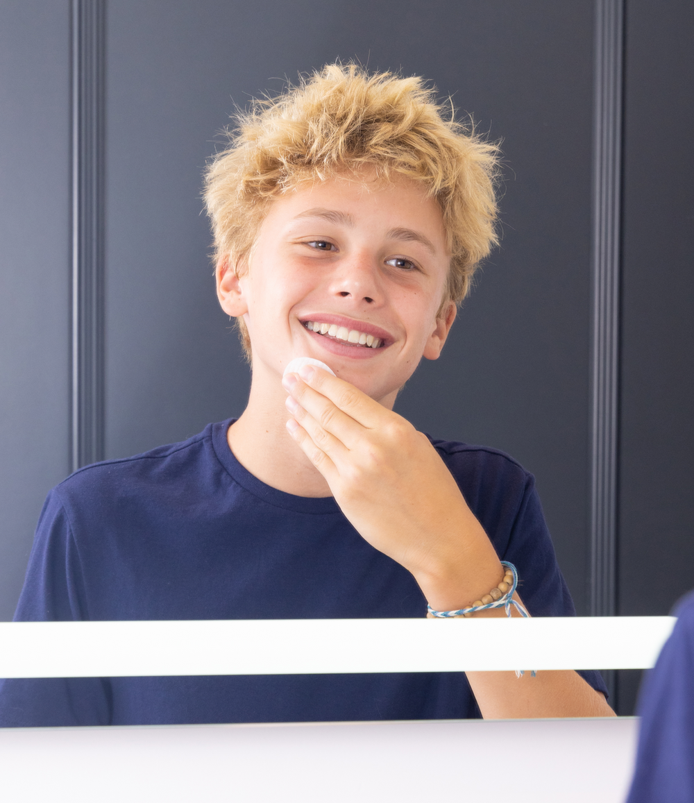 Teen boy using JB SKRUB Face Pads