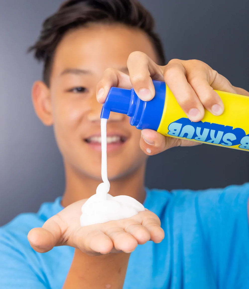 Teen boy using JB SKRUB Face Wash