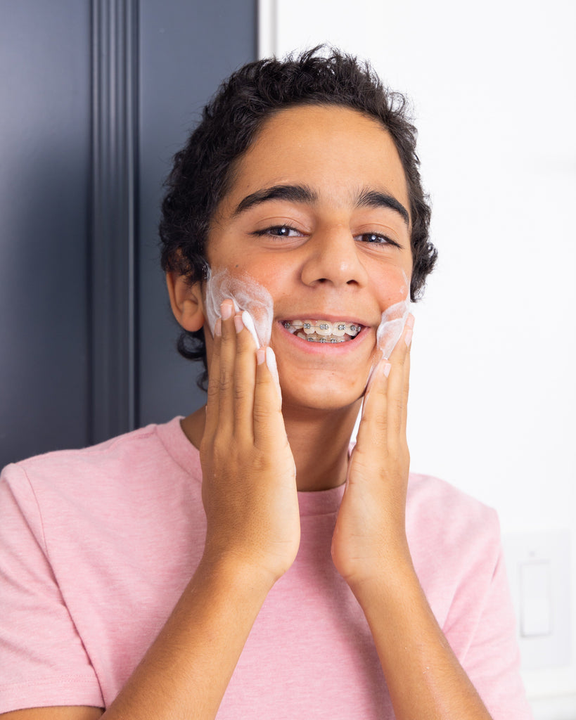 Boy washing face