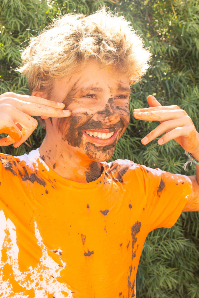 Teen Boy covered in mud